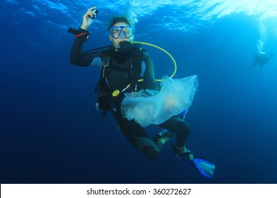 Scuba Diver Cleans Up Plastic Rubbish Pollution Discarded In Ocean