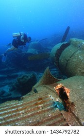 Scuba Diver Search Plane Crash Site Motor Unit And Wing