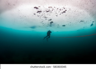 Scuba Diver Under The Ice