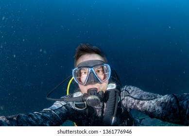 Scuba Diver Underwater Selfie Portrait In The Deep Blue Ocean