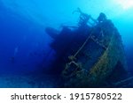 scuba divers enjoying famous giannis d ship wreck in clear water 