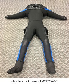 Scuba Diving Dry Suit Blown Up And Laying On Floor