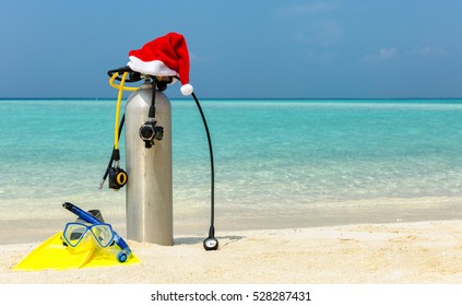 Scuba Diving Gear On Tropical Beach With A Christmas Hat