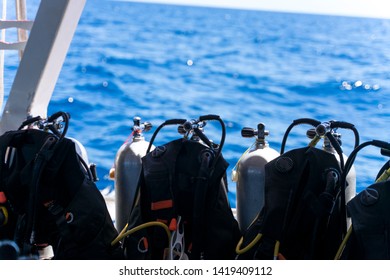 scuba regulator first stage and buoyancy control device bcd  on tank - Shutterstock ID 1419409112