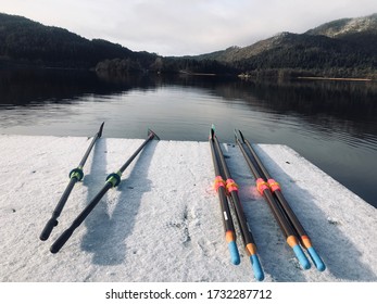 Sculling Oars On A Snowy Dock