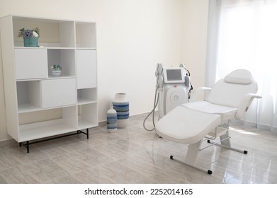 The sculp body treatment machine with a white bad in the white room, cabinet in the cosmetology, beauty center, clinic, salon.Cosmetology devices. - Shutterstock ID 2252014165
