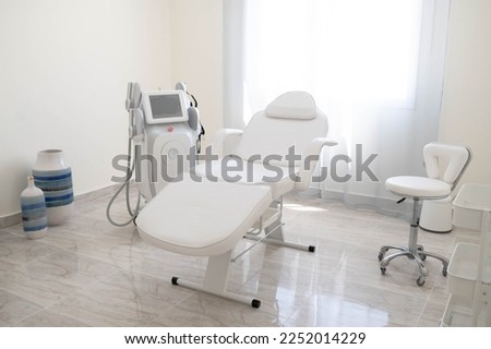 The sculp body treatment machine with a white bad in the white room, cabinet in the cosmetology, beauty center, clinic, salon.Cosmetology devices.