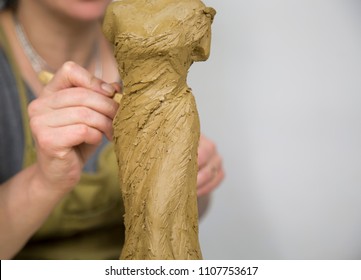 Sculptor Artist Creating A Bust Sculpture With Clay. Sculptor At Work.