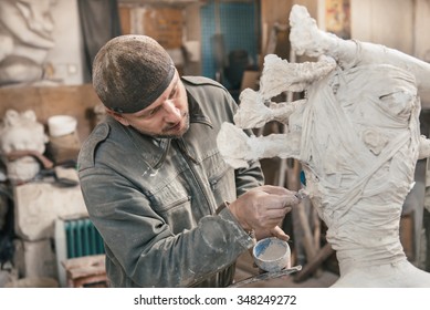 Sculptor Man Ã?Â?Ã?Â�reating Sculpture From Plaster And Clay In His Workshop