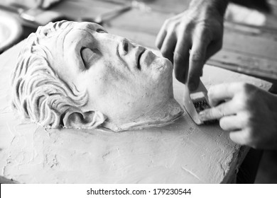 Sculptor Working On Head Sculpture