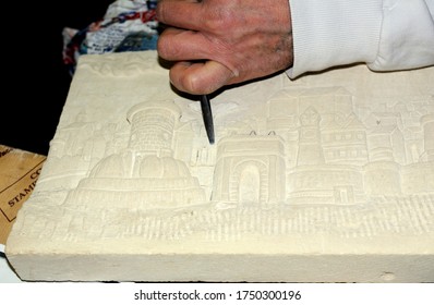 Sculptor Working On A Stone Bas-relief