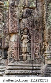A sculpture of Apsara figure with gesture on the great Angkor ancient temple.