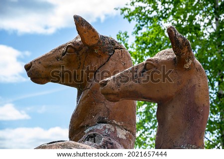 sculpture of deer made of plaster, in the forest