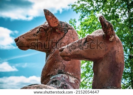 sculpture of deer made of plaster, in the forest