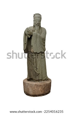 Sculpture figure granite carved antique Chinese philosopher holding a book  isolated on white background. Ancient Chinese stone dolls sculpture in Wat Pho temple in Bangkok, Thailand. 
