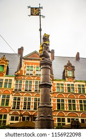 The sculpture of Flemish lion, holding the Coat of Arms at Sint Veerleplein square in the historic city center of Ghent (Gent), Belgium