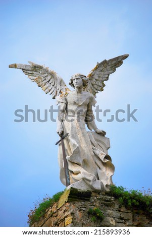 Sculpture  of a Guardian angel with a sword in the cemetery of Comillas. Cantabria - Spain