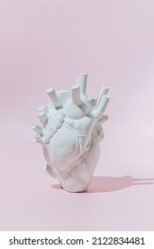 Sculpture Heart on a pink background. Creative Love, Valentine's day concept.