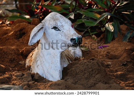 sculpture of holy white cow