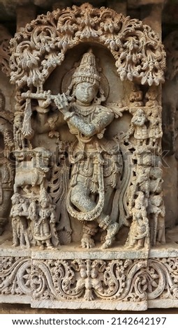 Sculpture of Lord Krishna playing flute, Lakshminarsimha Temple, Javagal , Hassan, Karnataka, India