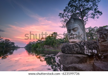 Sculpture outside south gate of Angkor Thom at sunset, Siem Reap, Cambodia