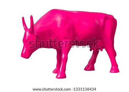 
Sculpture of a pink cow on an isolated background