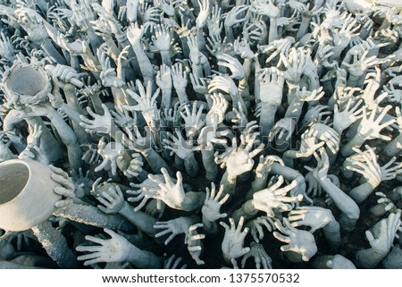 
sculpture purgatory and hell. People pull hands up. Thailand