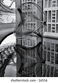 Sculpture in a reflecting pool