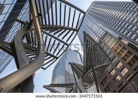 Sculpture and urban office buildings on Stephen Avenue Walk, Downtown, Calgary, Alberta, Canada, North America