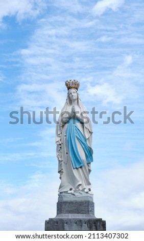 sculpture of the Virgin Mary in the sanctuary ofLourdes, France. place of worship and pilgrimage for christians