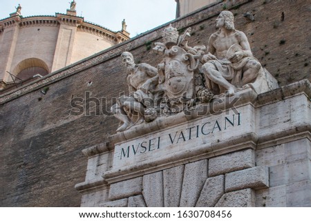 Sculptures above an entrance to the Vatican Museum in Rome, Italy (MVSEI VATICANI as shown means Vatican Museum)