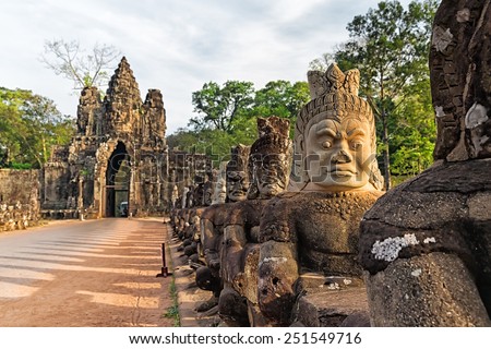 Sculptures of demons of Asia. South gate to Angkor Thom in Cambodia.