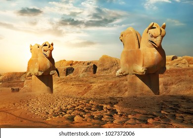 Sculptures Of Griffins In Ancient Persepolis Against The Backdrop Of The Rising Sun. Iran. Ancient Persia.