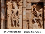 Sculptures of Hindu gods on facade of 7th century temple in India. Architecture of 7th century with carved walls in Pattadakal.