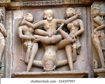Sculptures of loving couples, illustrating the Kama Sutra, on walls of  Kandariya Mahadeva Temple at  Khajuraho in  India, Asia