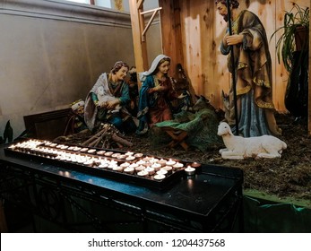 Sculptures Of The Virgin Mary, St. Joseph, The Shepherd And The Sheep At The Empty Cradle In The Catholic Church. Waiting For Christmas, Advent.
