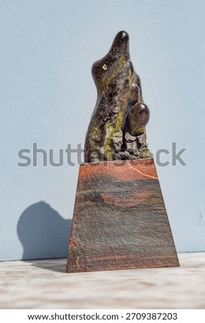 Scum penguin with its egg