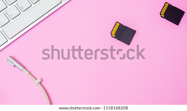 sd card\
and charge with keyboard on pink\
background