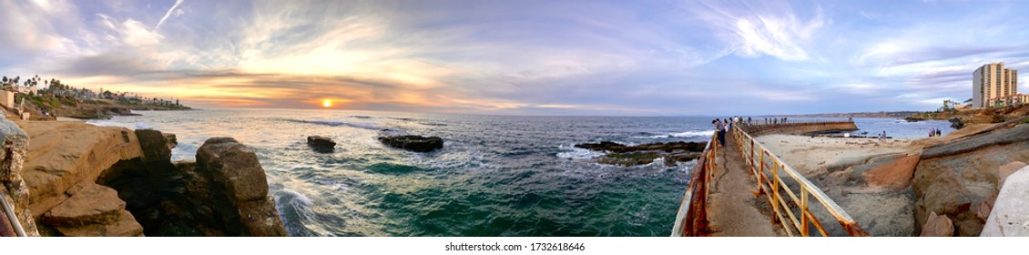 SD USA-dec 5 2019:panoramic sunset view of La Jolla San Diego and ocean shore and stones in water