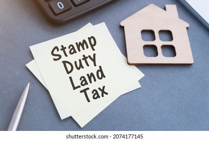 SDLT - Stamp Duty Land Tax Write On A Card On Office Desk.