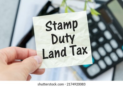 SDLT - Stamp Duty Land Tax Write On A Card On Office Desk.