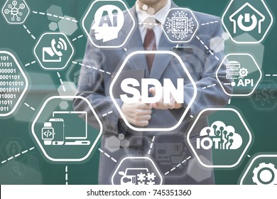 SDN - Software Defined Networking Business concept. Young developer using virtual touchscreen pressing sdn text button.
