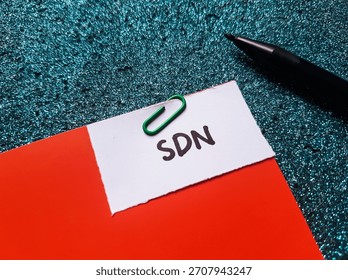 SDN writting on table background. 