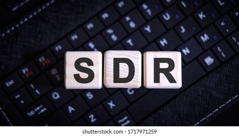 SDR Serpstat Domain Rank - concept on wooden cubes on a keyboard