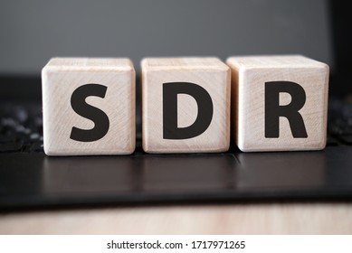 SDR Serpstat Domain Rank - concept on wooden cubes on a black keyboard