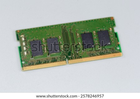 SDRAM memory module SO-DIMM, used in the desktop computers on a gray surface