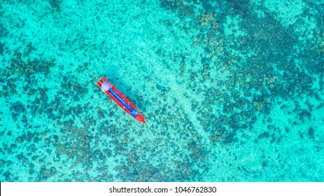 Sea Aerial view, Top view,amazing nature background.The color of the water and beautifully bright.Azure beach with rocky mountains and clear water of Thailand ocean at sunny day.flying drone,sea view
