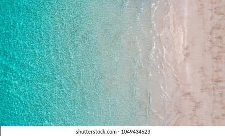Sea Aerial view, Top view,amazing nature background.The color of the water and beautifully bright.Azure beach with rocky mountains and clear water of Thailand ocean at sunny day.flying drone,sea view