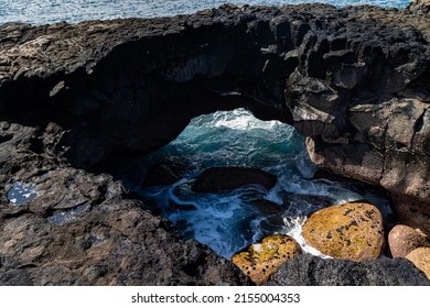 Sea Arch on Volcanic Shoreline of Keiki Beach, Hawaii Island, Hawaii, USA