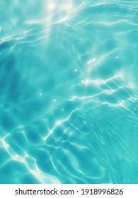 Reflection​ on​ surface​ blue​ water​ in​ the​ sea. Abstract​ of​ surface​ blue​ water​ for​ background. Closeup​ abstract​ of​ surface​ blue​ water. Splash​ed​ water​ in the​ swimming​pool. Water​